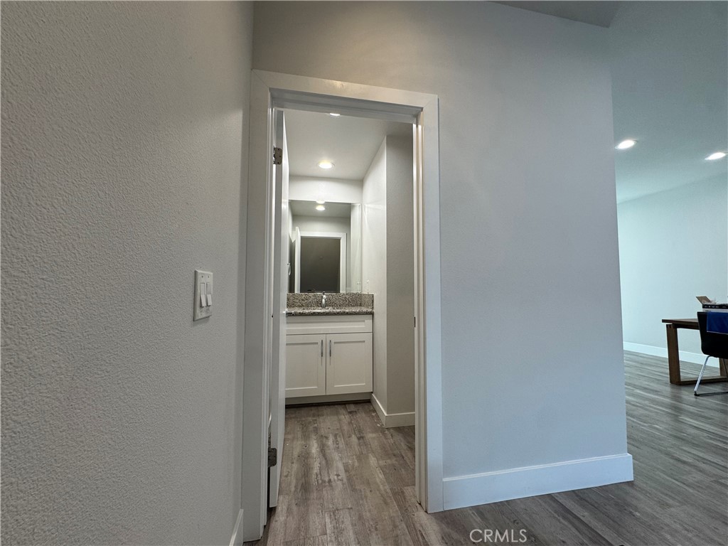 7958 Telegraph Road Downey, CA 90240 - Photo 7 of 38 a view of bathroom with a sink mirror and window