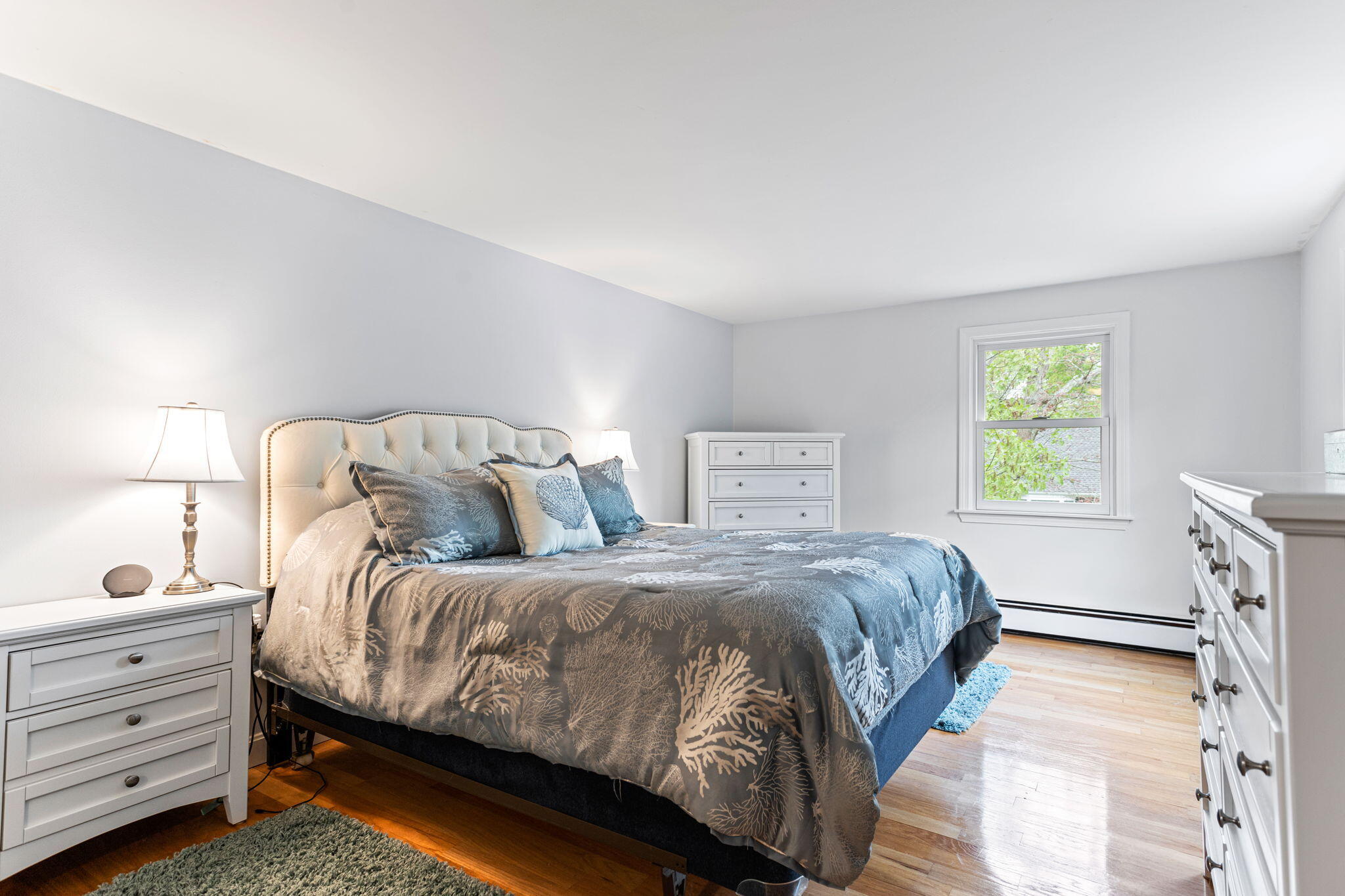 75 Lake Leaman Road Falmouth, MA 02540 - Photo 14 of 30 a bedroom with a bed and a window