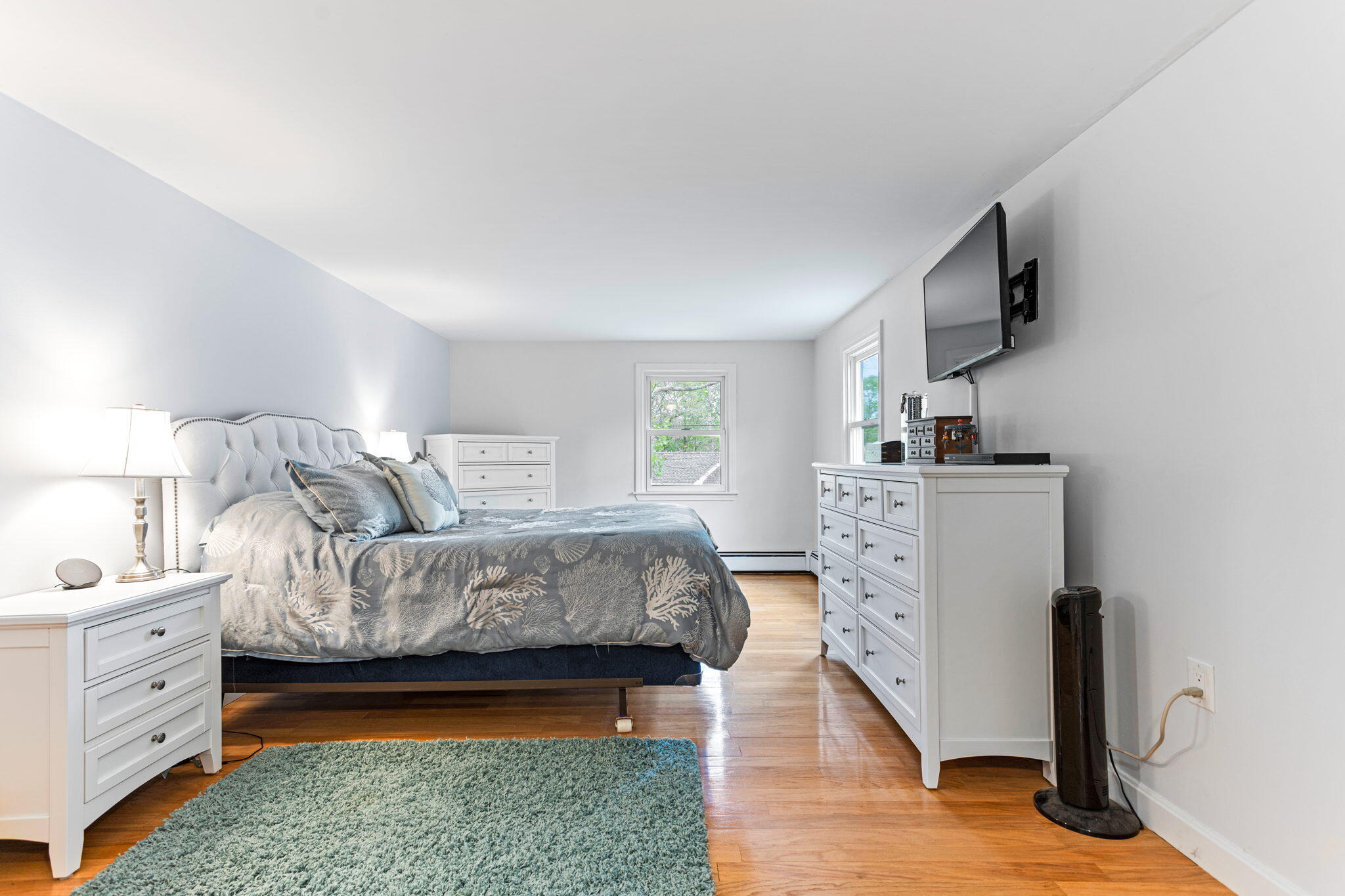 75 Lake Leaman Road Falmouth, MA 02540 - Photo 15 of 30 a bedroom with furniture and a fireplace