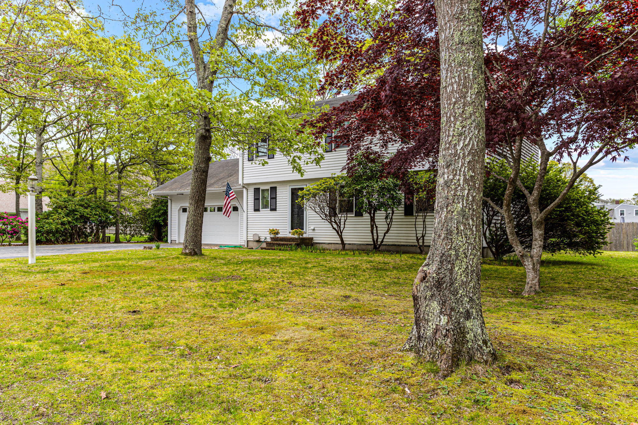 75 Lake Leaman Road Falmouth, MA 02540 - Photo 24 of 30 a view of a house with a yard and tree s