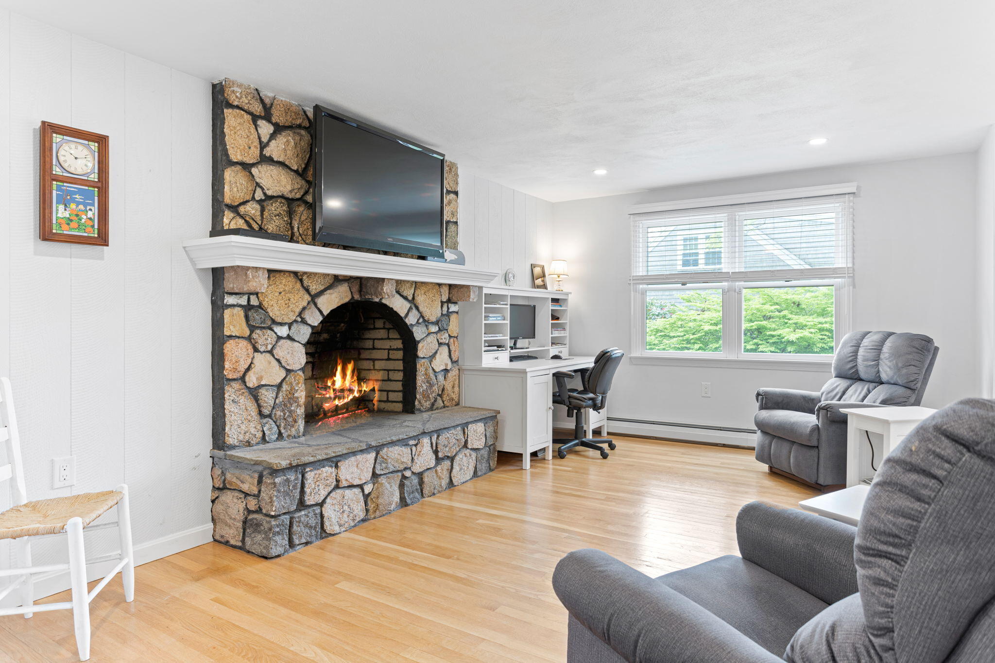 75 Lake Leaman Road Falmouth, MA 02540 - Photo 3 of 30 a living room with furniture and a fireplace