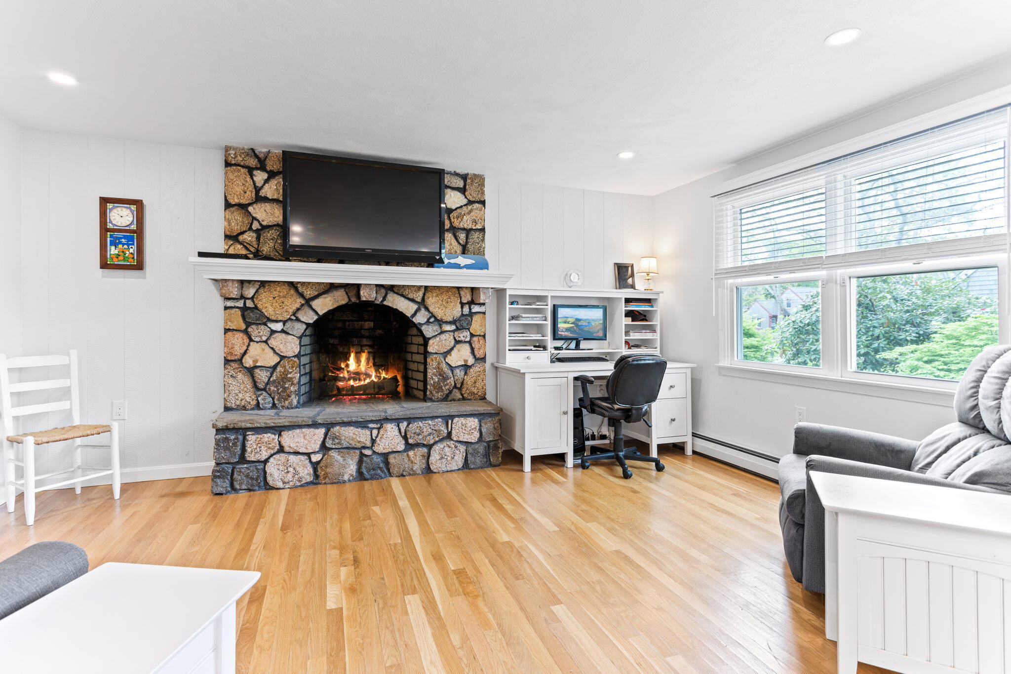 75 Lake Leaman Road Falmouth, MA 02540 - Photo 4 of 30 a living room with furniture and a fireplace