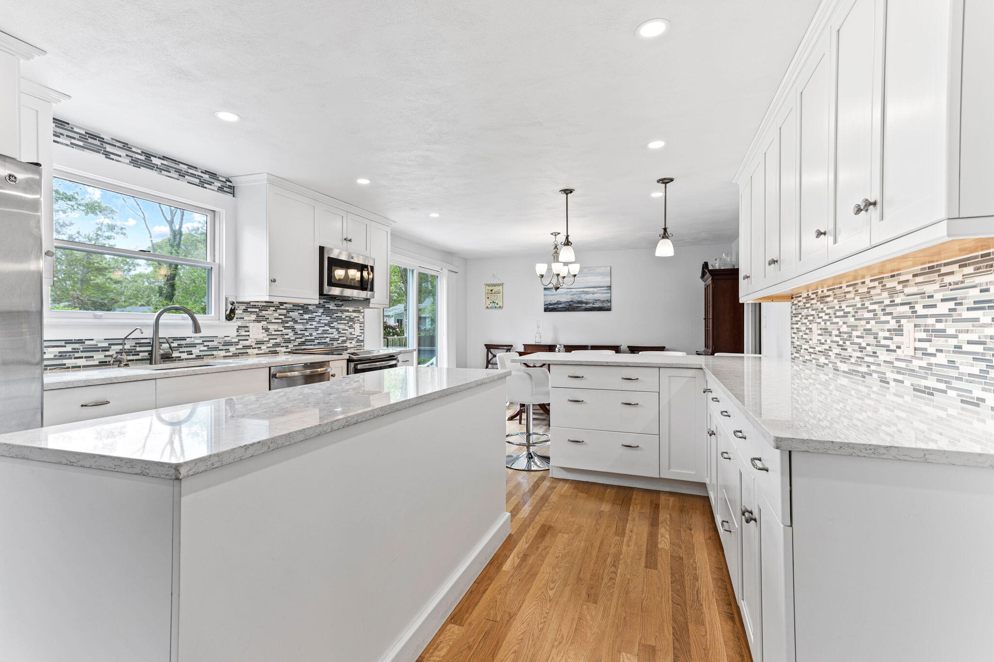 75 Lake Leaman Road Falmouth, MA 02540 - Photo 6 of 30 a large white kitchen with a large window
