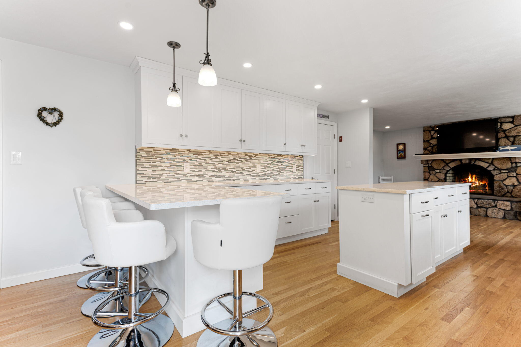 75 Lake Leaman Road Falmouth, MA 02540 - Photo 8 of 30 a kitchen with stainless steel appliances kitchen island granite countertop a sink a stove and a wooden floors