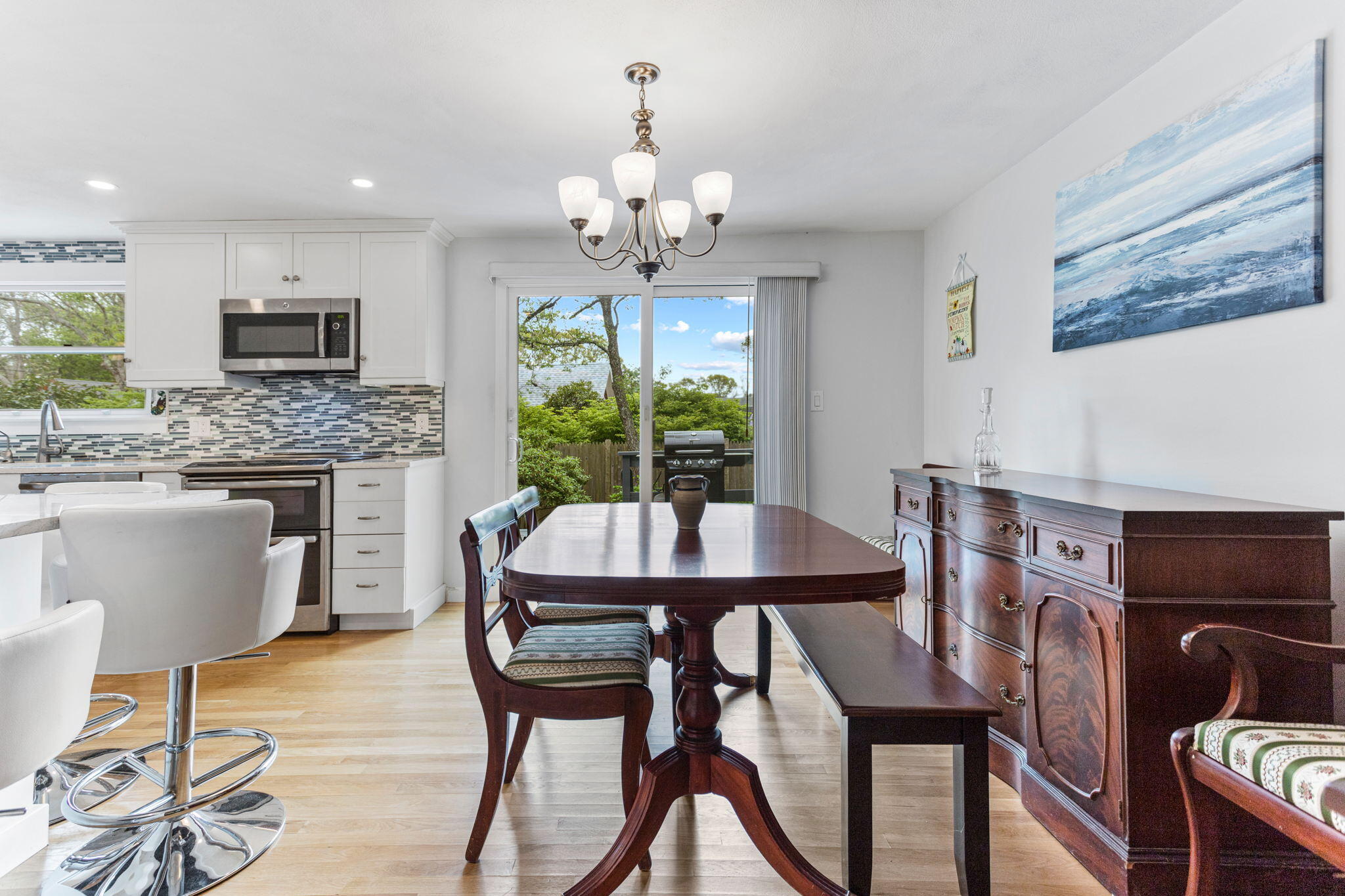 75 Lake Leaman Road Falmouth, MA 02540 - Photo 10 of 30 a view of a dining room with furniture window and wooden floor