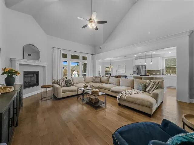 an aerial view of residential building and lake