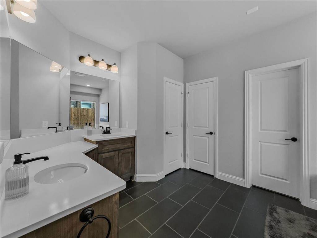 428 Piper Lane Fate, TX 75087 - Photo 15 of 33 Spa-like primary bath with built-in audio speakers.