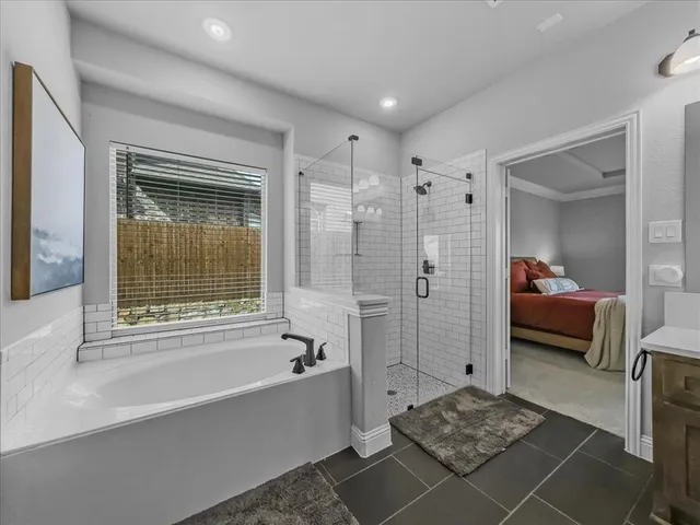 a spacious bathroom with a sink and a mirror