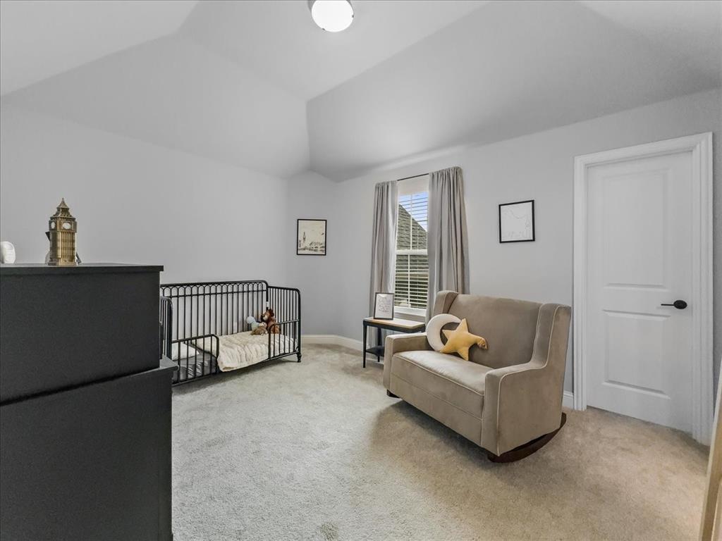 428 Piper Lane Fate, TX 75087 - Photo 20 of 33 Upstairs bedroom features a walk-in closet and abundant natural light