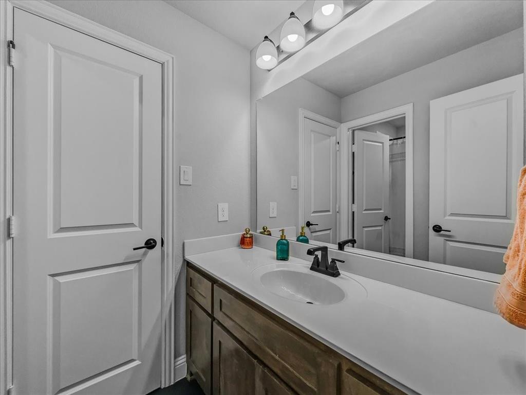 428 Piper Lane Fate, TX 75087 - Photo 21 of 33 Shared Jack-and-Jill bathroom with dual access.