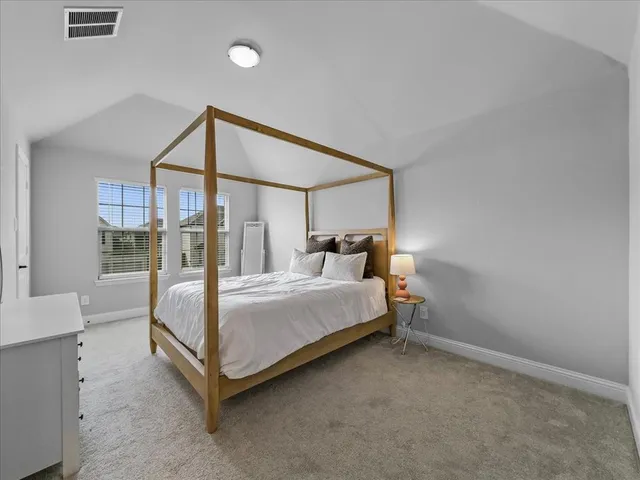 a bathroom with a double vanity sink a mirror and a shower