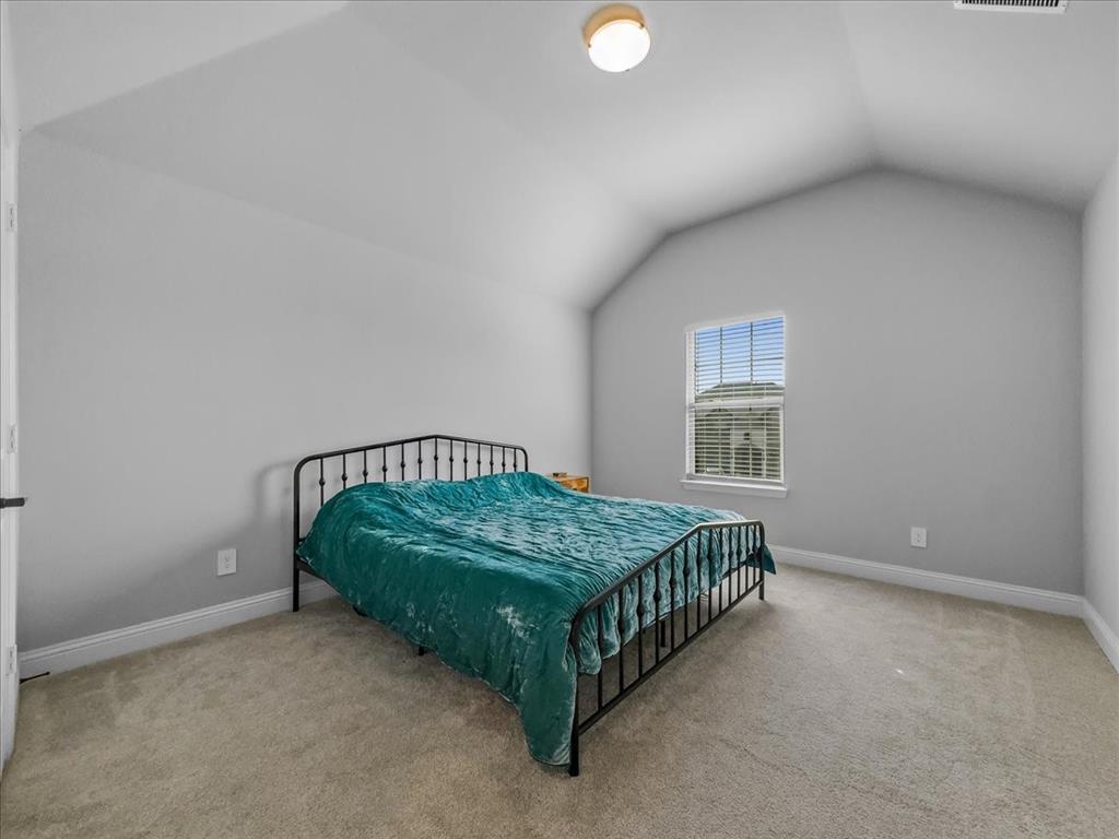 428 Piper Lane Fate, TX 75087 - Photo 23 of 33 Comfortable bedroom with walk-in closet and ample natural light