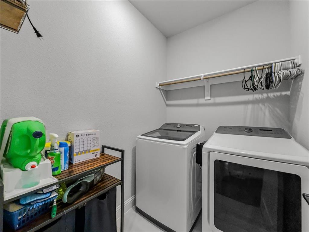 428 Piper Lane Fate, TX 75087 - Photo 28 of 33 Functional laundry room with ample space for everyday use.