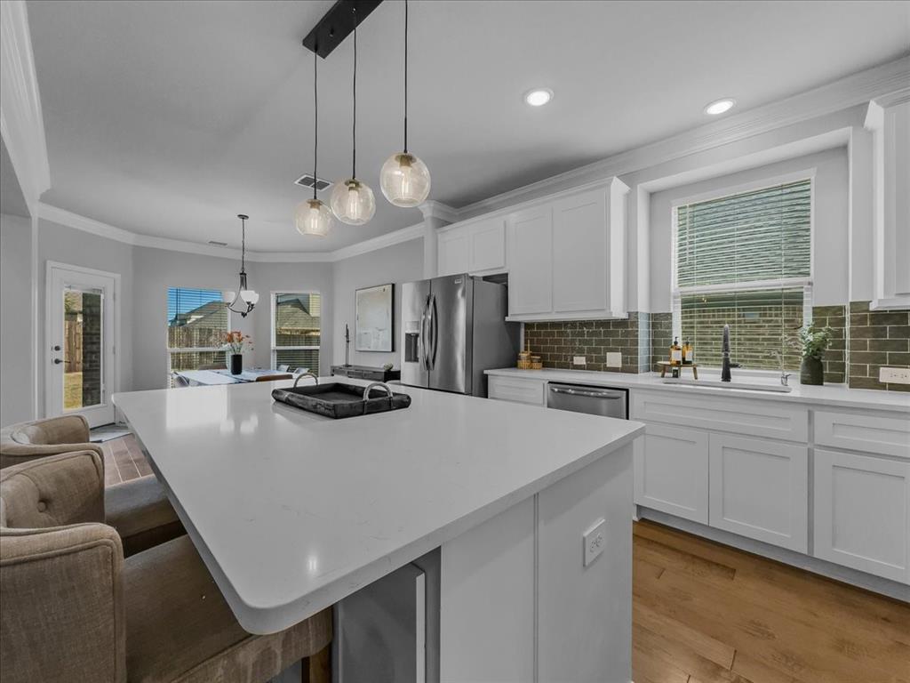 428 Piper Lane Fate, TX 75087 - Photo 5 of 33 California island provides ample prep space and convenient built-in storage