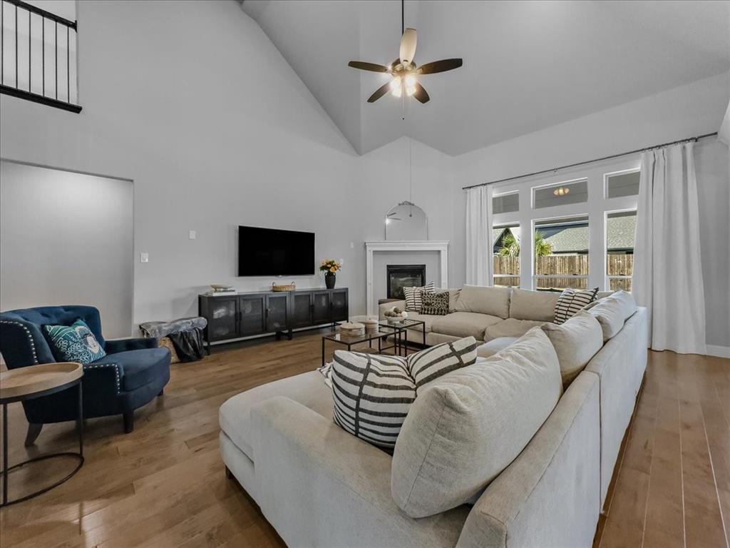 428 Piper Lane Fate, TX 75087 - Photo 10 of 33 Bright living room with extended windows offering abundant natural light