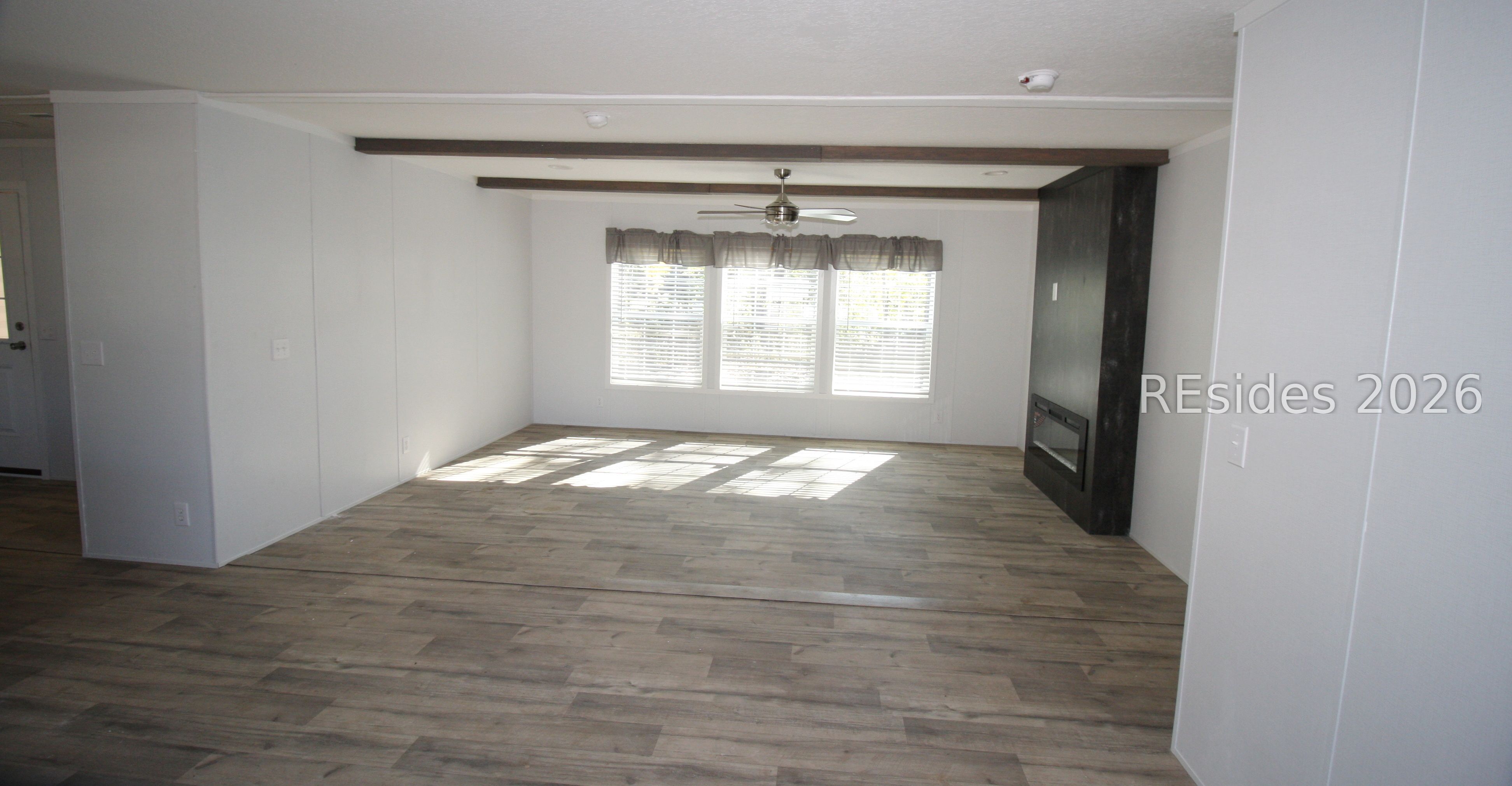 22 Unity Lane Seabrook, SC 29940 - Photo 2 of 21 Living room with fireplace