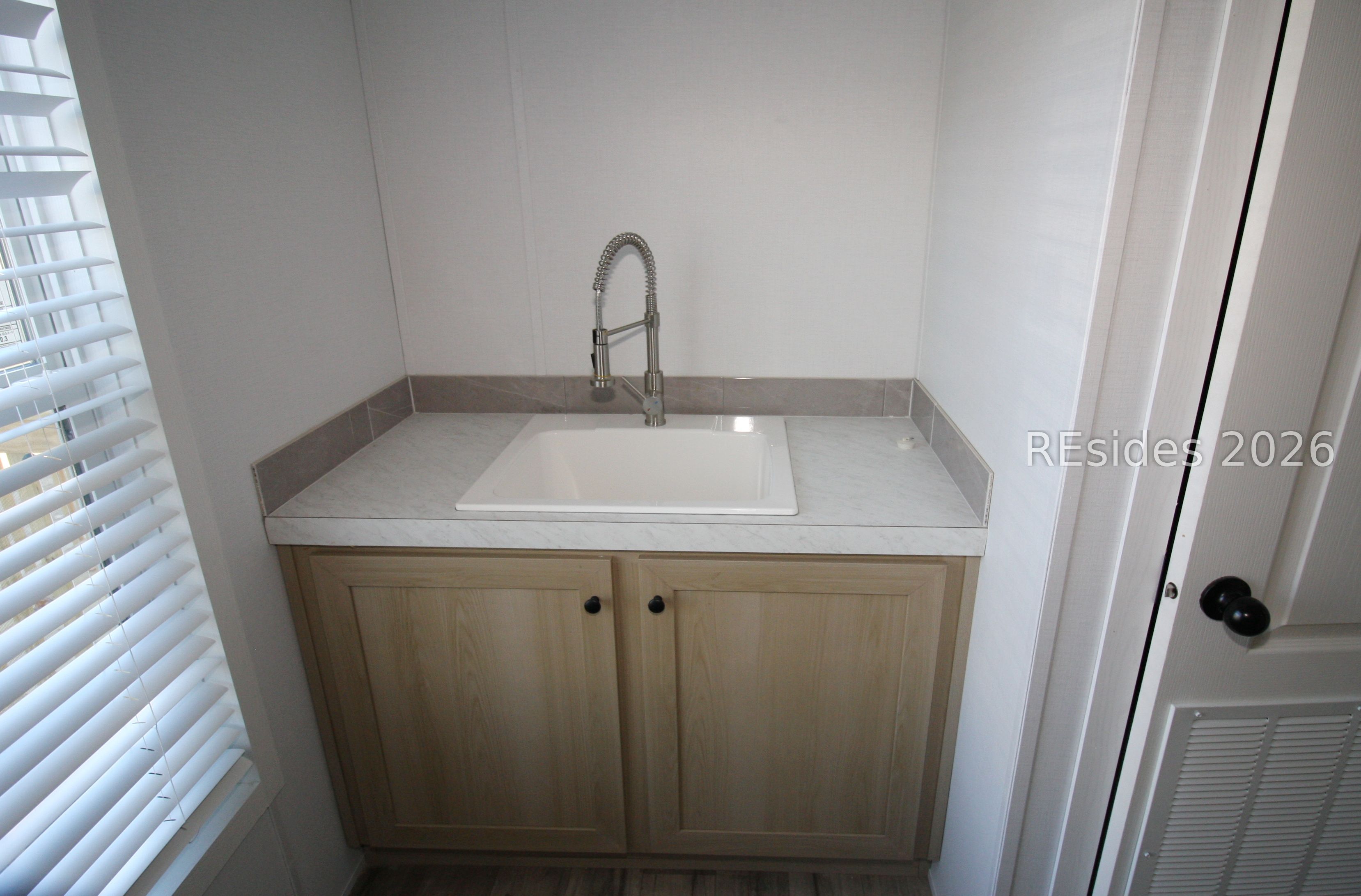 22 Unity Lane Seabrook, SC 29940 - Photo 8 of 21 Laudry room