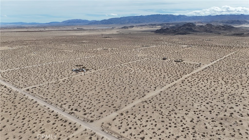 66220 Sonora Road Joshua Tree, CA 92252 - Photo 11 of 17 a view of an ocean beach and mountain