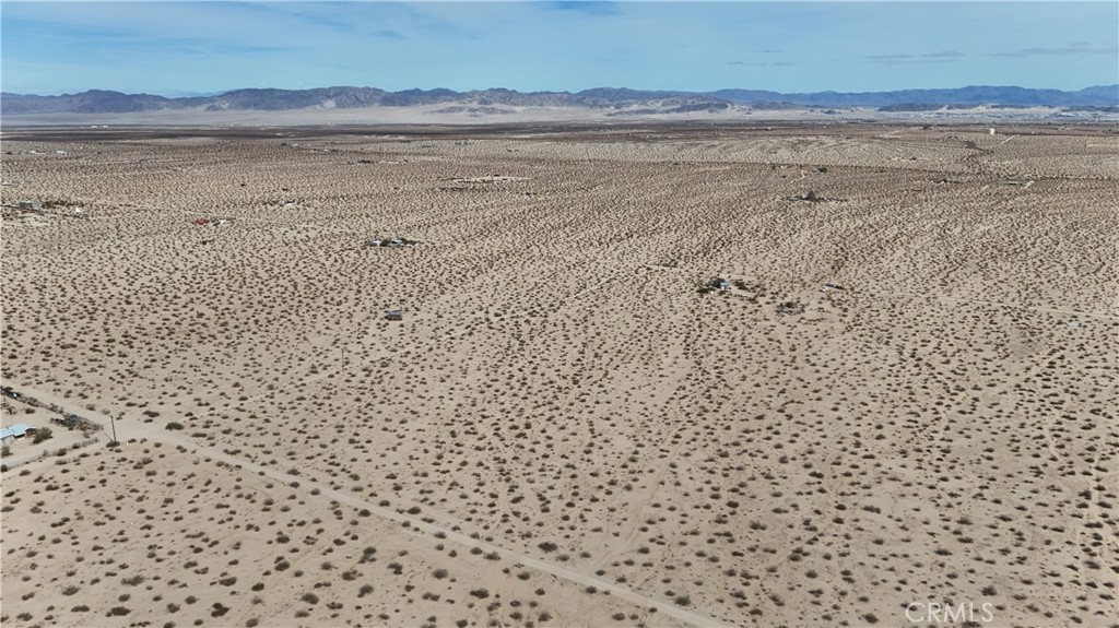 66220 Sonora Road Joshua Tree, CA 92252 - Photo 12 of 17 a view of an ocean beach and mountain