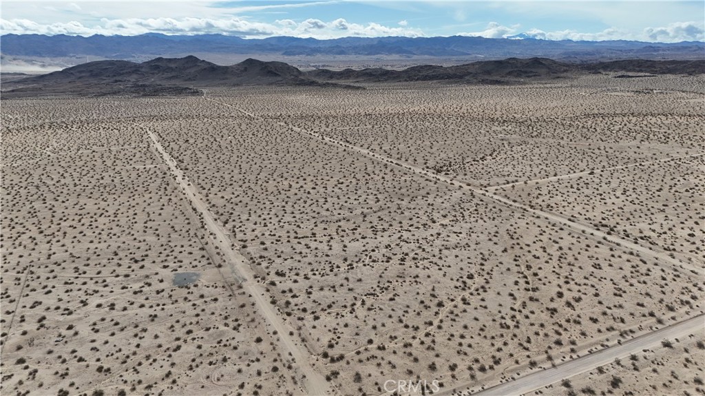 66220 Sonora Road Joshua Tree, CA 92252 - Photo 10 of 17 a view of a wooden floor with a mountain