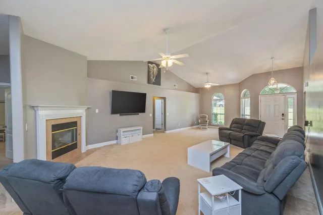 a view of a swimming pool with an outdoor seating