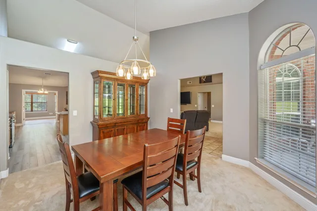 an aerial view of a house with yard swimming pool and outdoor seating