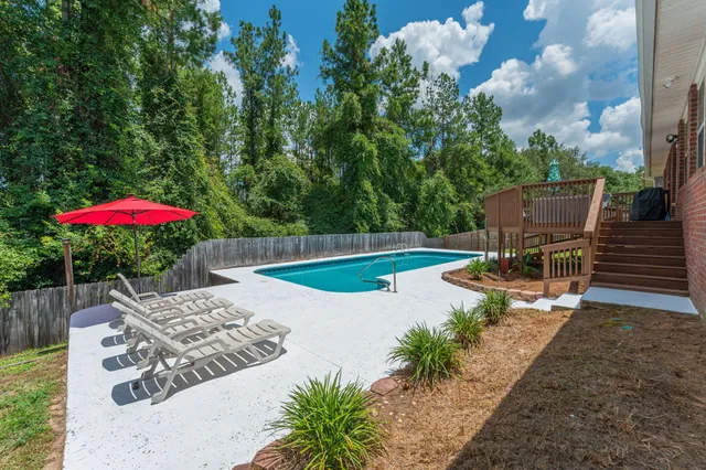 a view of a dining room with furniture and a window