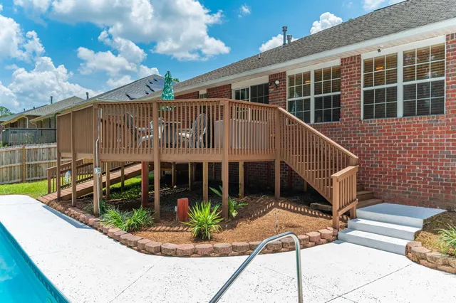 a bedroom with a bed and a ceiling fan