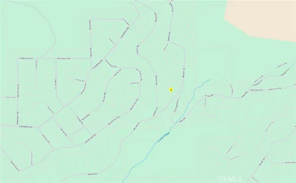 a backyard of a house with a tree