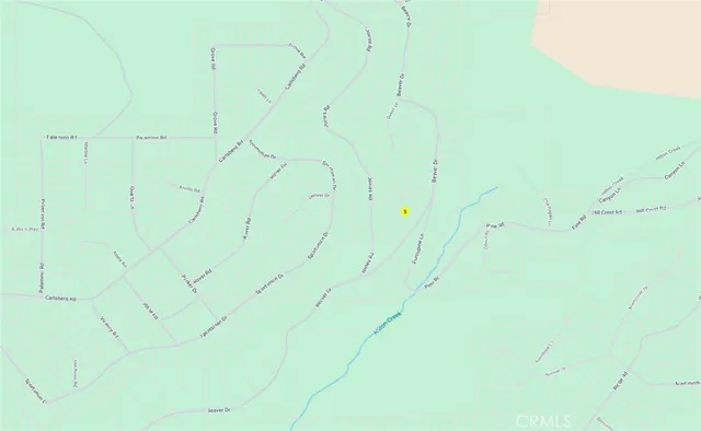 a backyard of a house with a tree