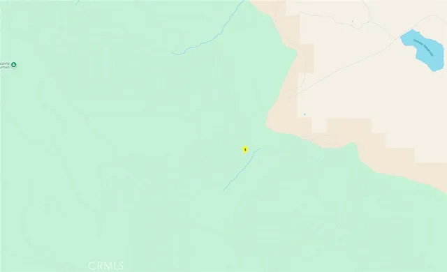 a view of a house with a forest