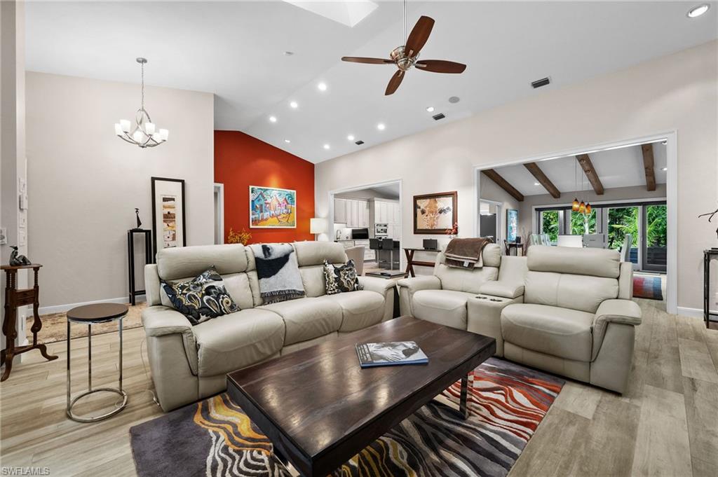 153 West Street Naples, FL 34108 - Photo 13 of 48 a living room with furniture a ceiling fan and a rug