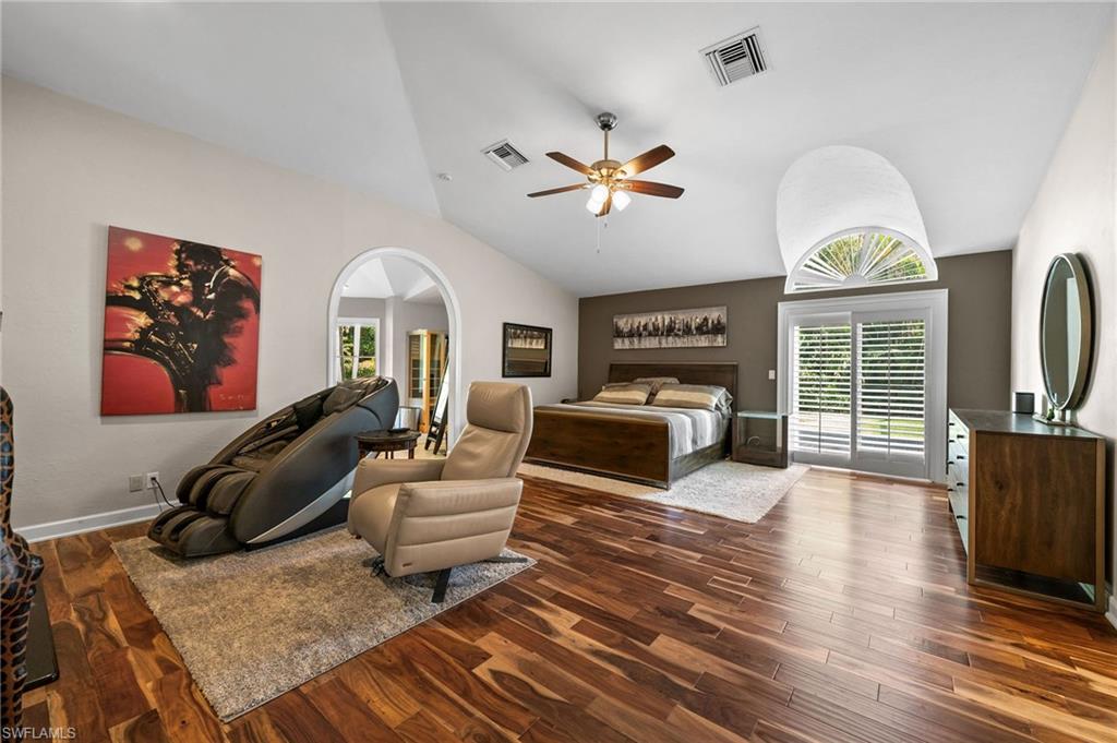 153 West Street Naples, FL 34108 - Photo 20 of 48 a living room with furniture a fireplace and a flat screen tv