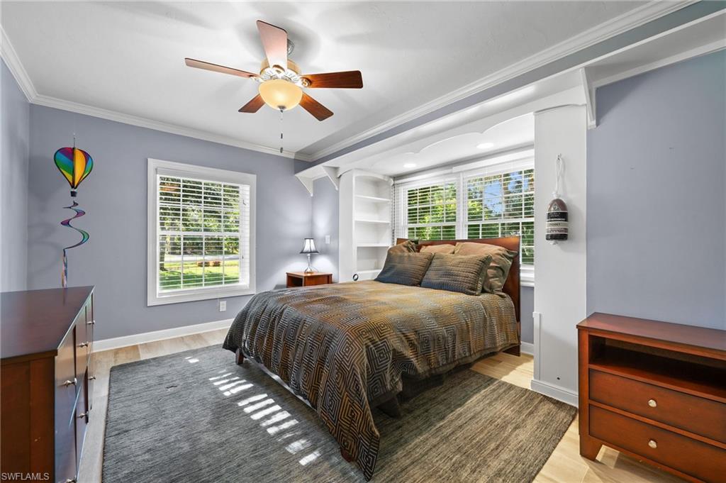 153 West Street Naples, FL 34108 - Photo 26 of 48 a spacious bedroom with a bed and window