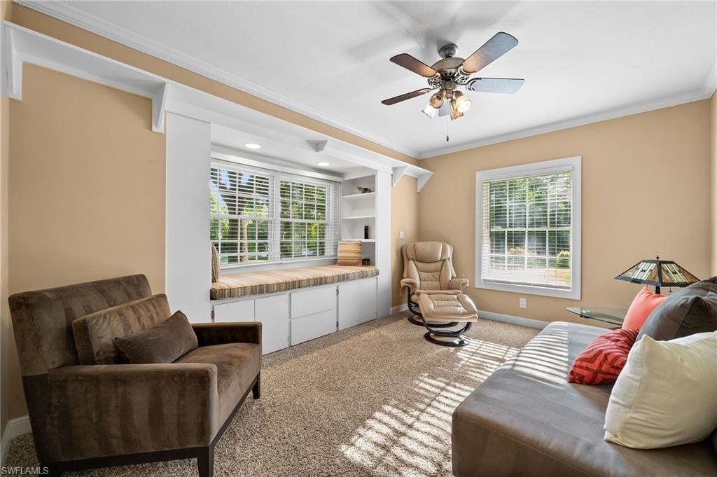 153 West Street Naples, FL 34108 - Photo 27 of 48 a living room with furniture and a large window