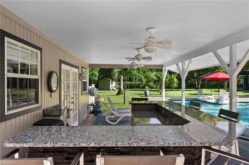153 West Street Naples, FL 34108 - Photo 35 of 48 a view of a livingroom with a table and chairs