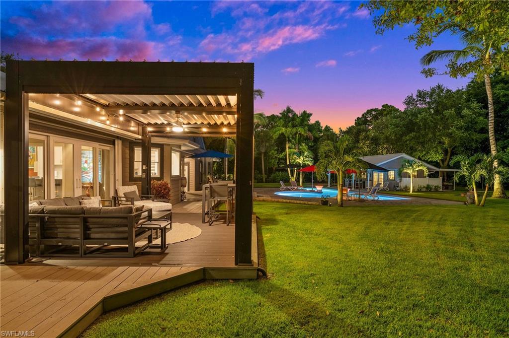 153 West Street Naples, FL 34108 - Photo 38 of 48 a view of a house with swimming pool and sitting area