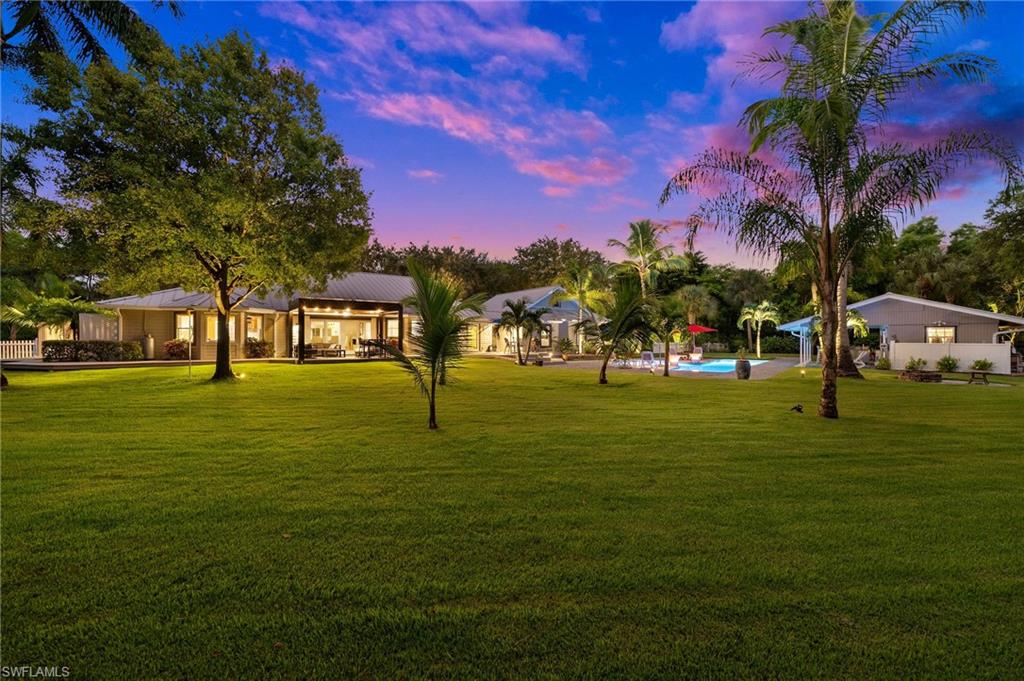 153 West Street Naples, FL 34108 - Photo 41 of 48 a park with trees in the background