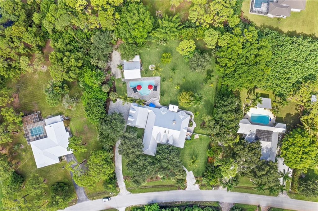 153 West Street Naples, FL 34108 - Photo 44 of 48 an aerial view of residential house with outdoor space and trees all around