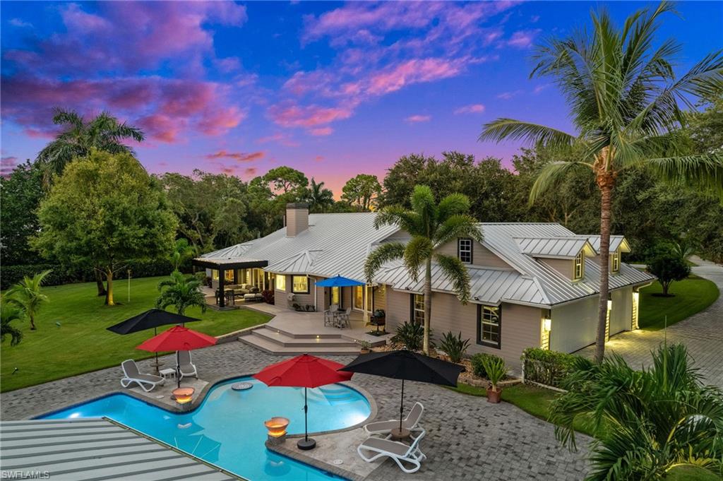 153 West Street Naples, FL 34108 - Photo 5 of 48 a view of houses with outdoor space and lake view