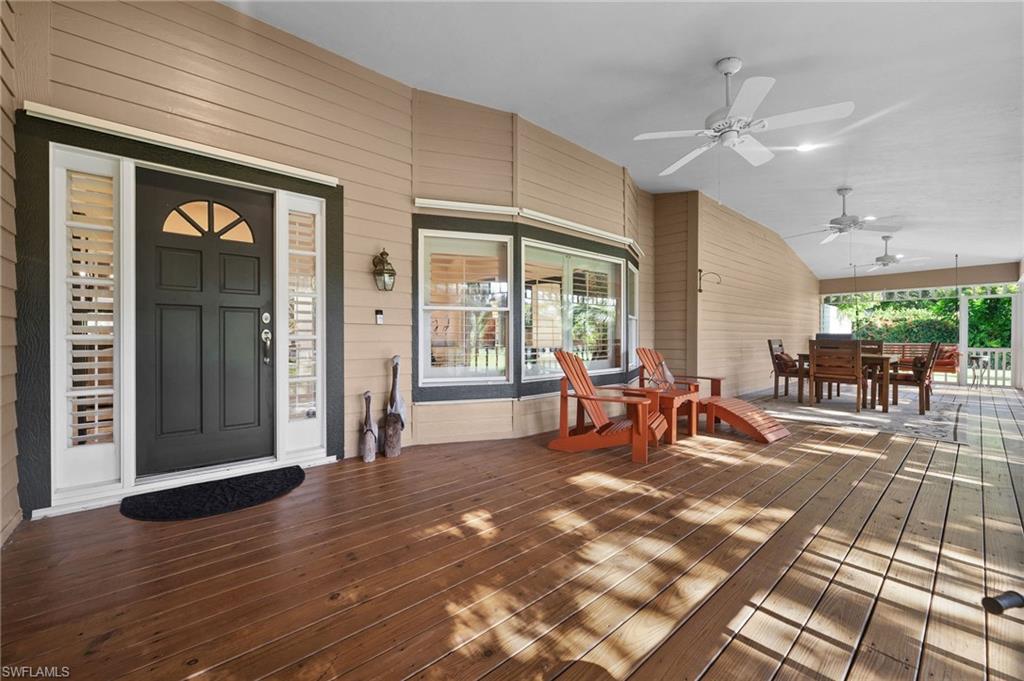 153 West Street Naples, FL 34108 - Photo 8 of 48 a view of a livingroom with furniture and floor to ceiling window