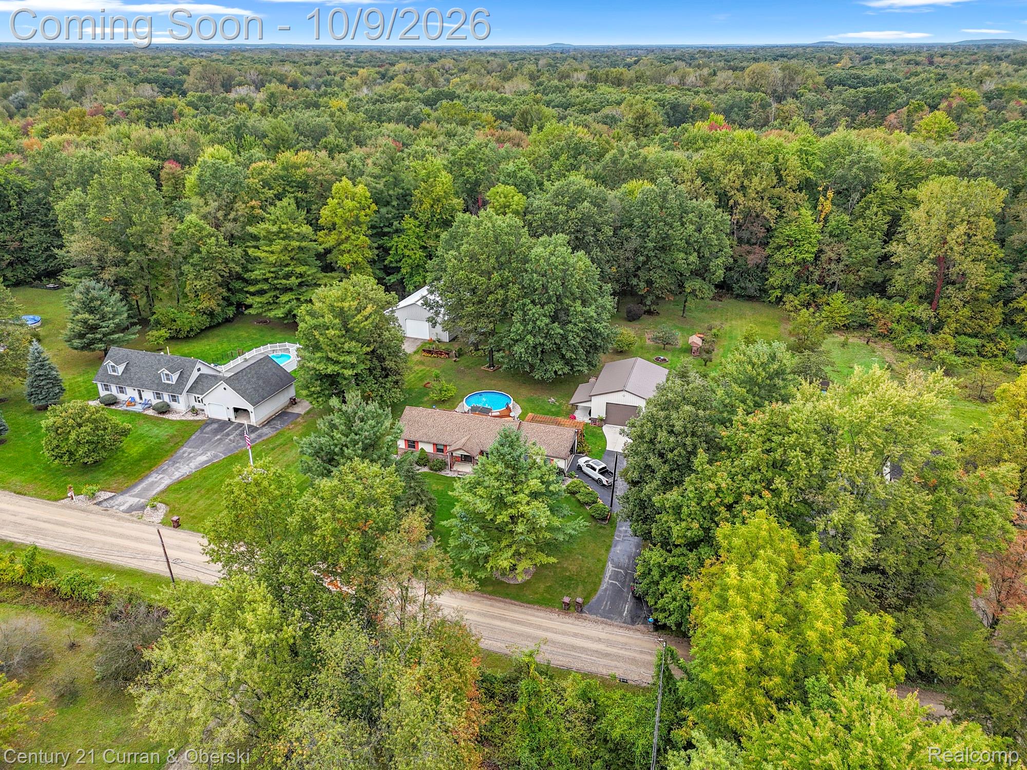 43040 Willis Road Belleville, MI 48111 - Photo 63 of 65 Aerial property capturing multiple structures, two private driveways, and expansive surrounding tree coverage