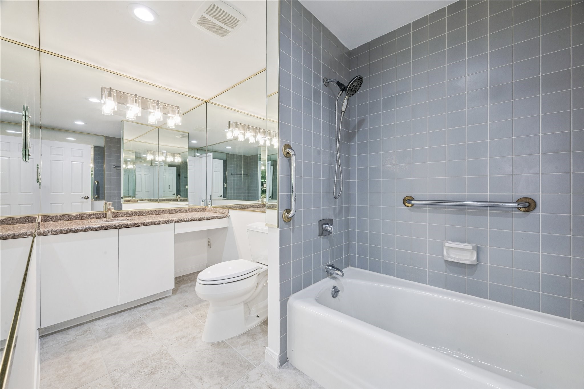 2001 Holcombe Boulevard, Unit 4006 Houston, TX 77030 - Photo 20 of 31 a bathroom with a sink a toilet and shower