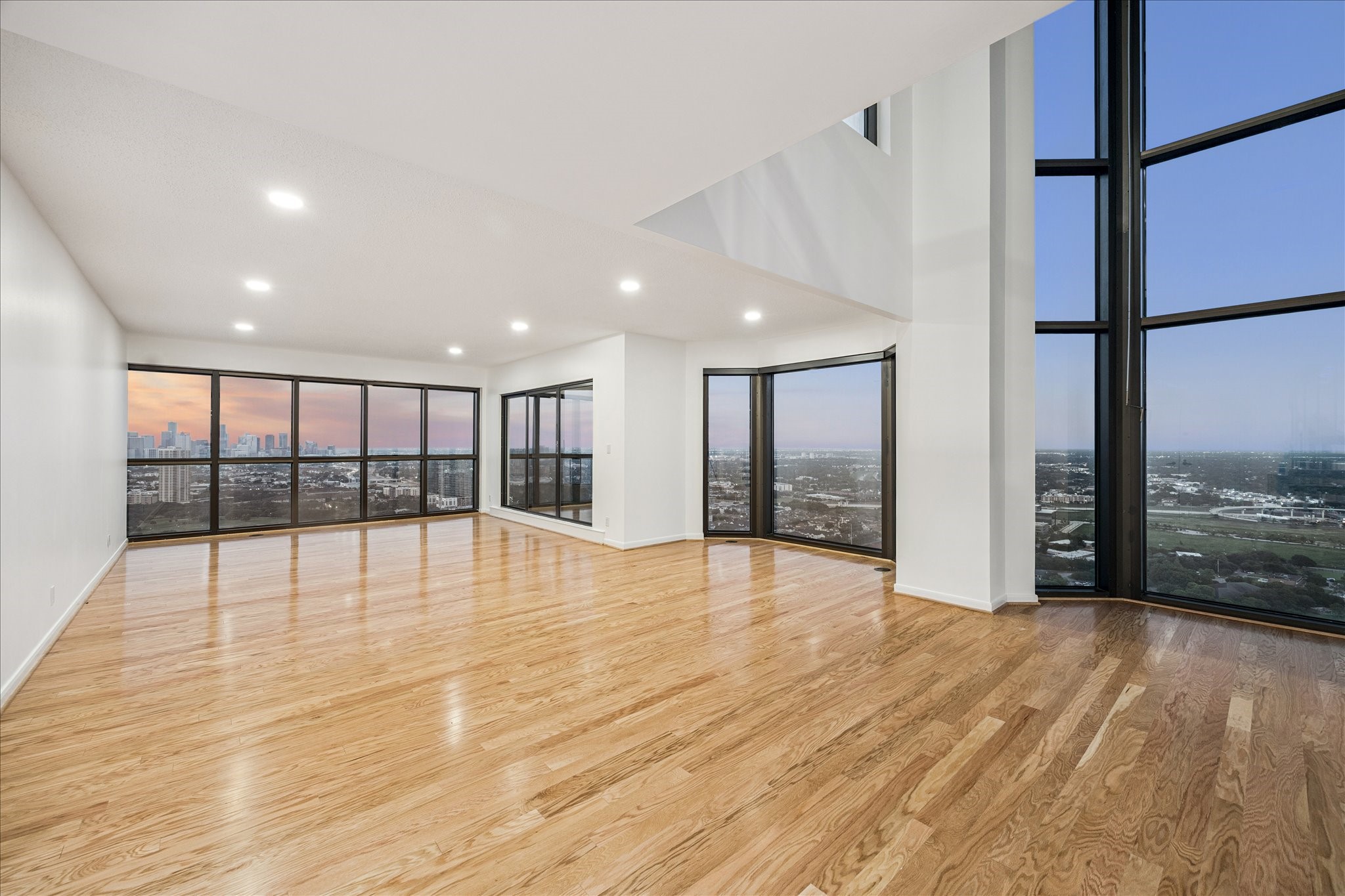 2001 Holcombe Boulevard, Unit 4006 Houston, TX 77030 - Photo 2 of 31 a view of an empty room with wooden floor and a window