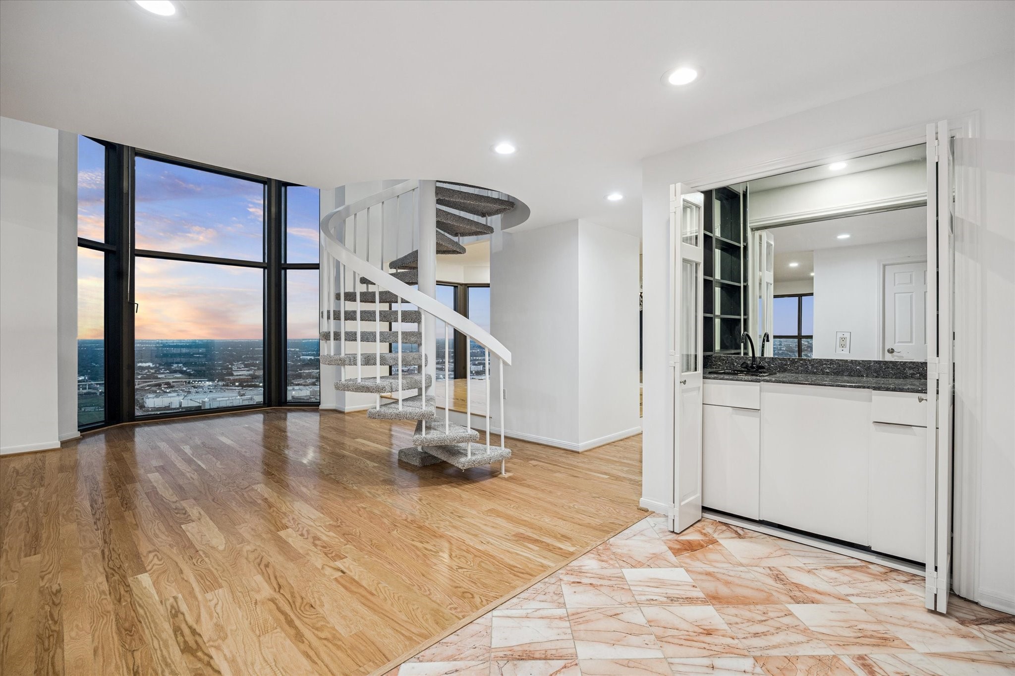 2001 Holcombe Boulevard, Unit 4006 Houston, TX 77030 - Photo 4 of 31 a view of a hallway with wooden floor and a bathroom