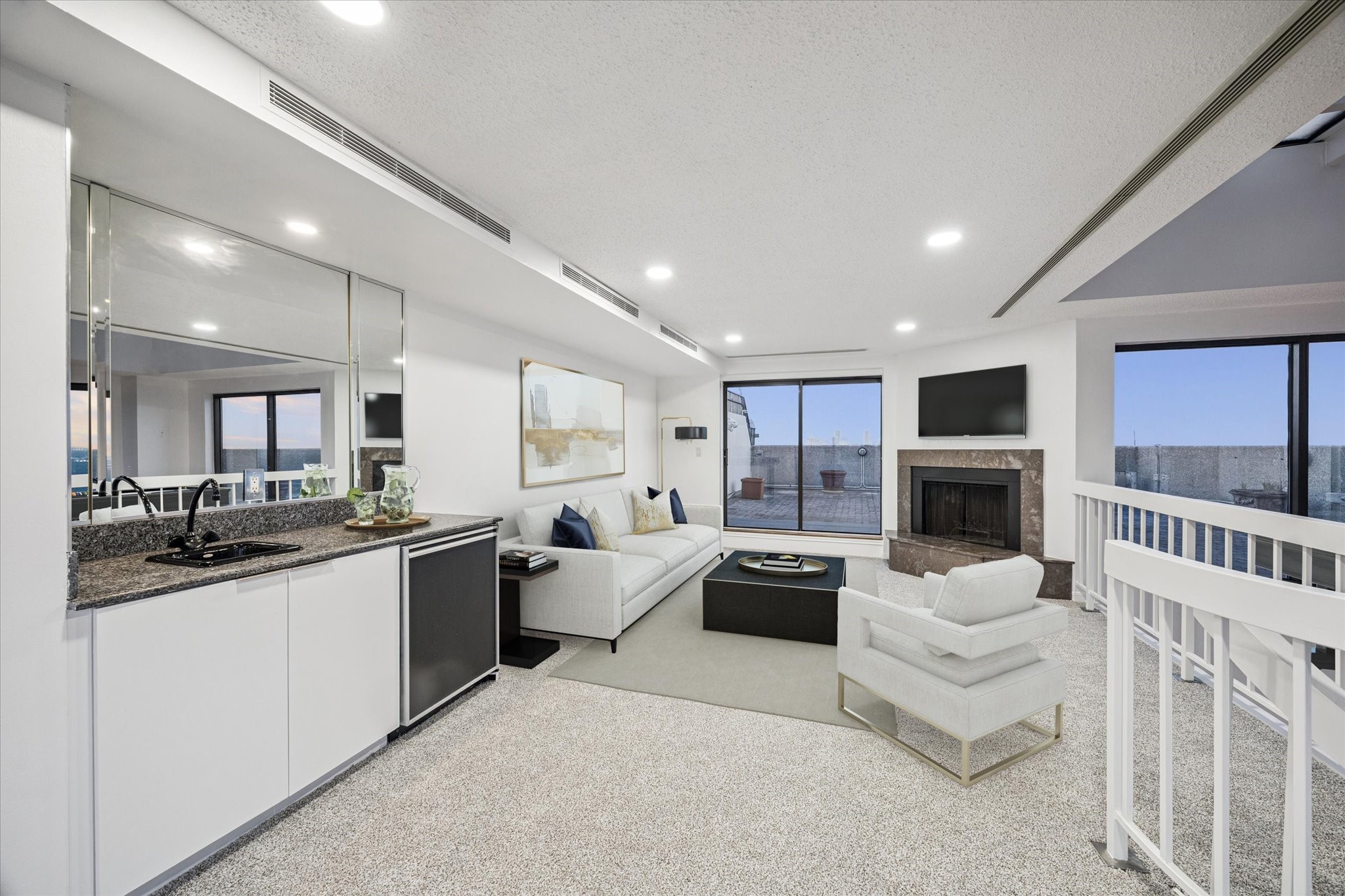 2001 Holcombe Boulevard, Unit 4006 Houston, TX 77030 - Photo 10 of 31 a large living room with stainless steel appliances furniture a rug and a kitchen
