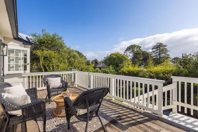 a view of a chairs and table on the deck