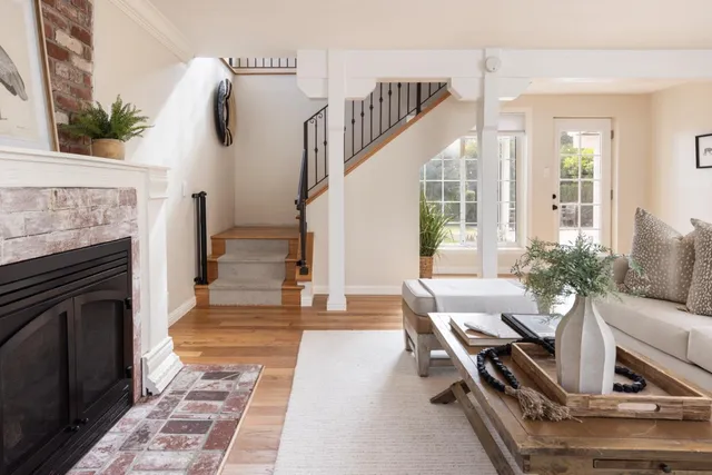 a living room with furniture and a fireplace