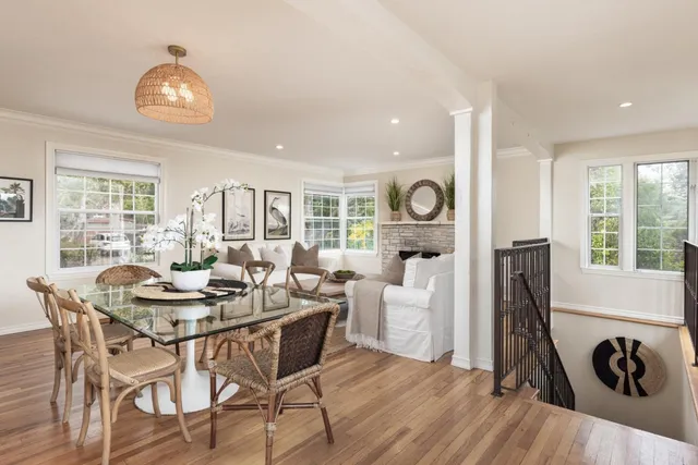 a dining room with furniture and a chandelier
