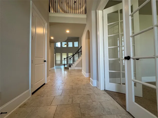 a view of a hallway with dining area